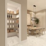 Minimalist pantry with shelves holding baskets, wine bottles, and paper towels, next to a dining area with a wooden table and modern lighting.