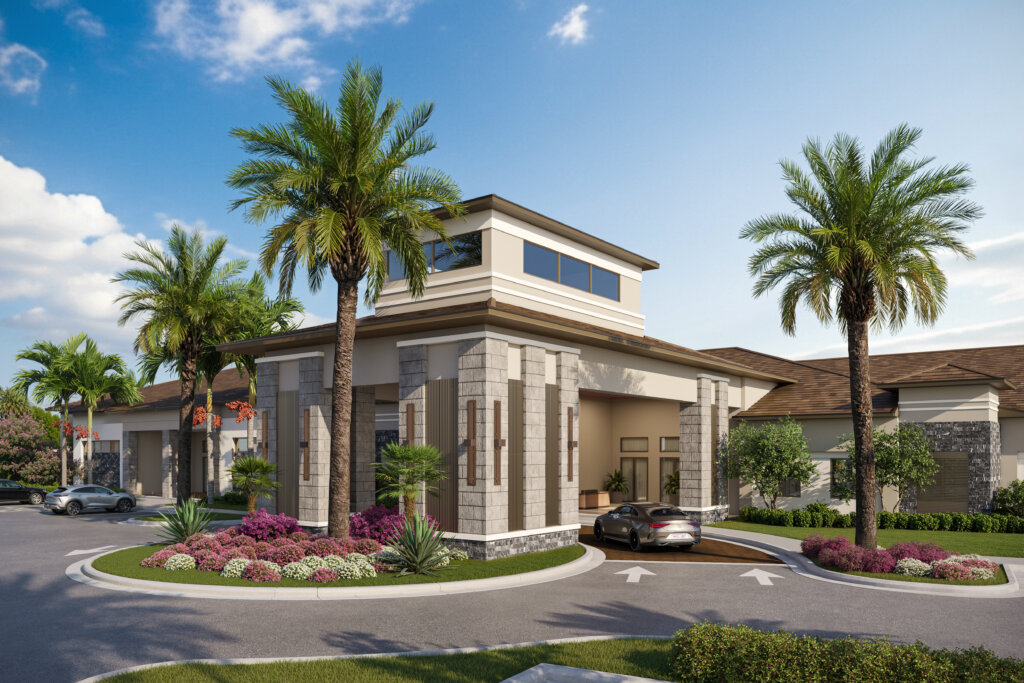 A modern building with tall columns and large windows, Catalina Palms offers elegant 55+ living amid palm trees, landscaped plants, and parked cars under a clear blue sky.